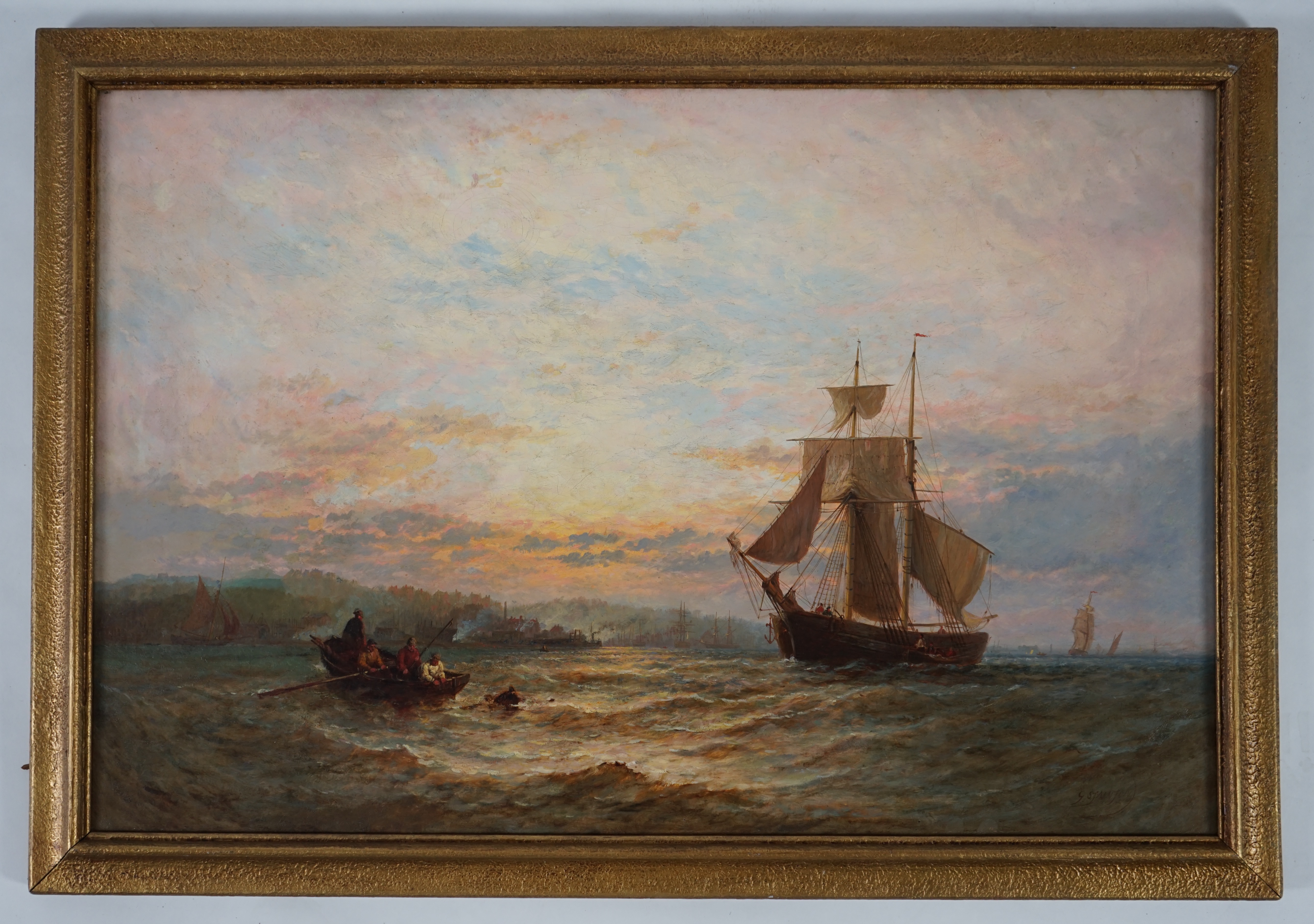George Stainton (British, fl. 1860-1890), Shipping in a calm sea at dawn, oil on canvas, 60 x 90cm